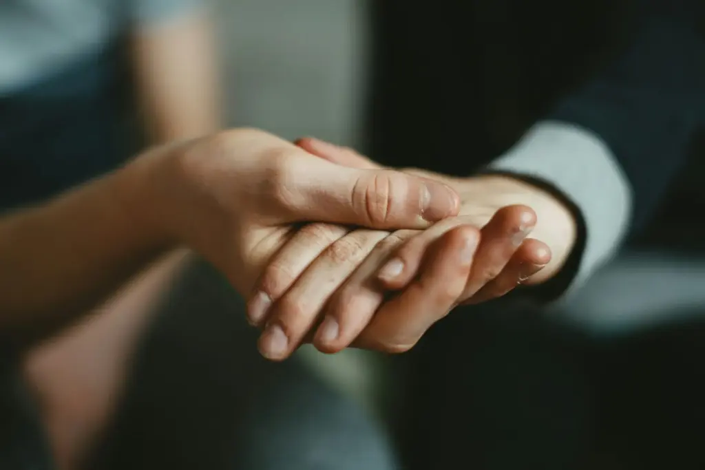 person holding babys hand person holding babys hand