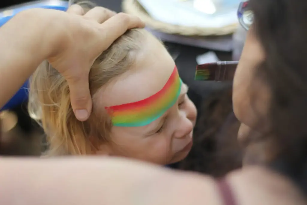 woman stroking child's hair woman stroking child's hair