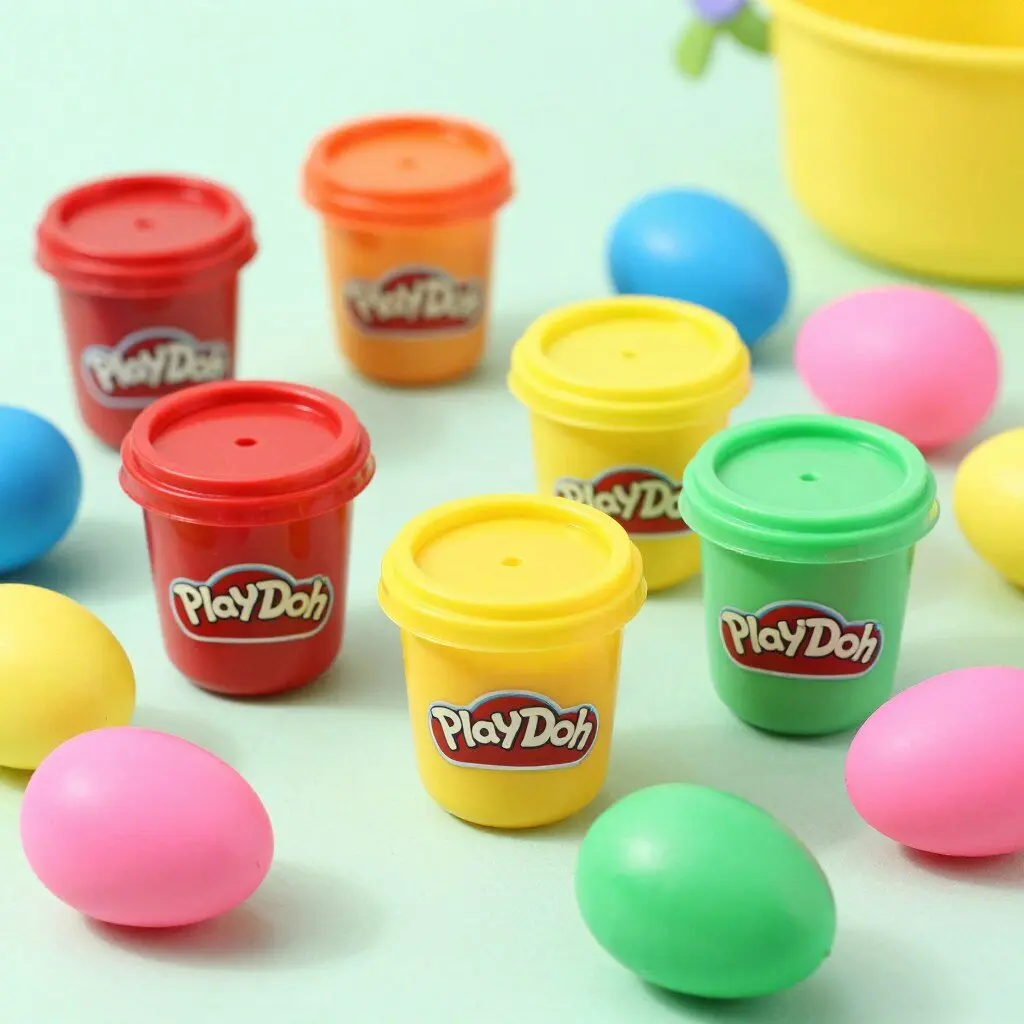Small Play-Doh containers in bright colors perfect for Easter eggs