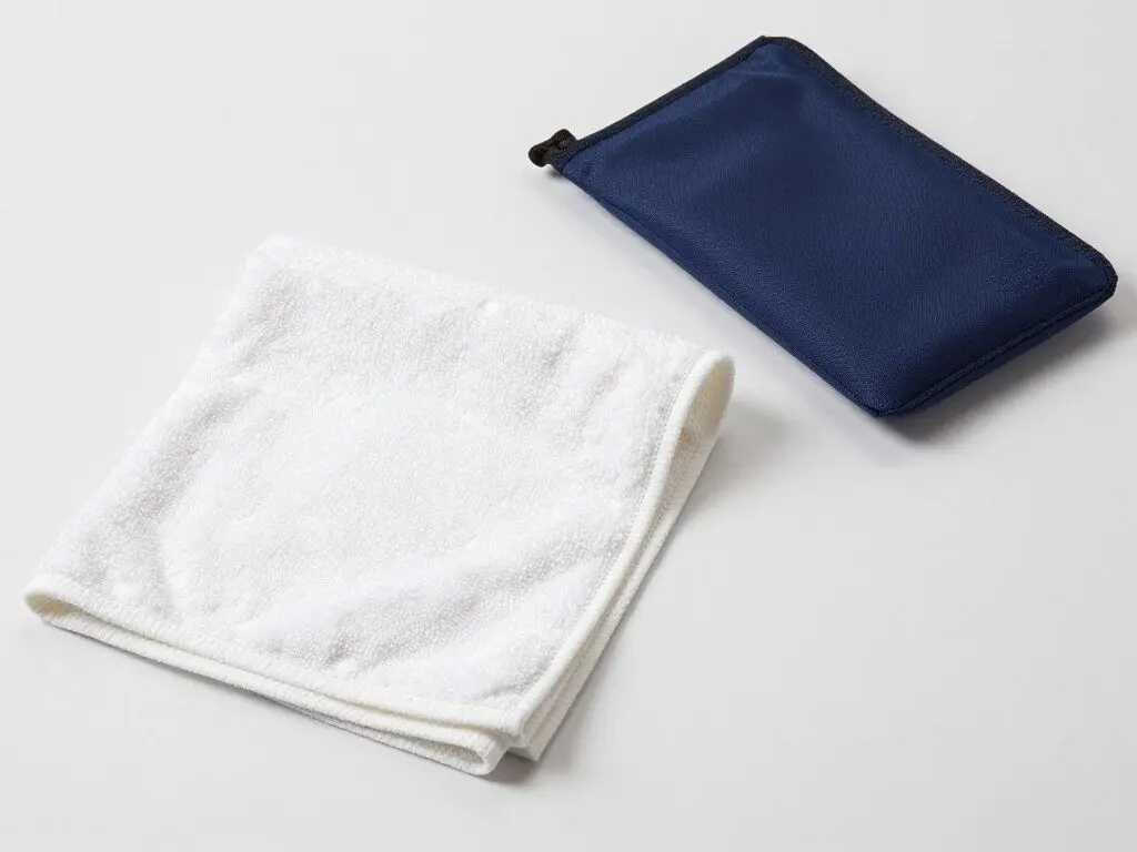 Compact microfiber travel towel with carrying pouch