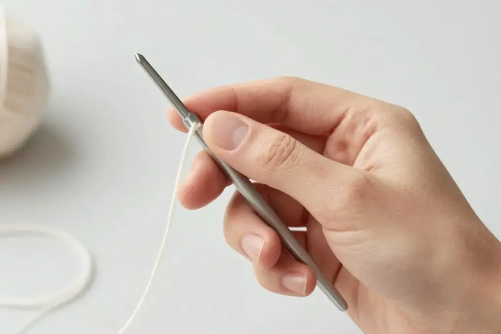Pencil grip showing how to hold a crochet hook for beginners
