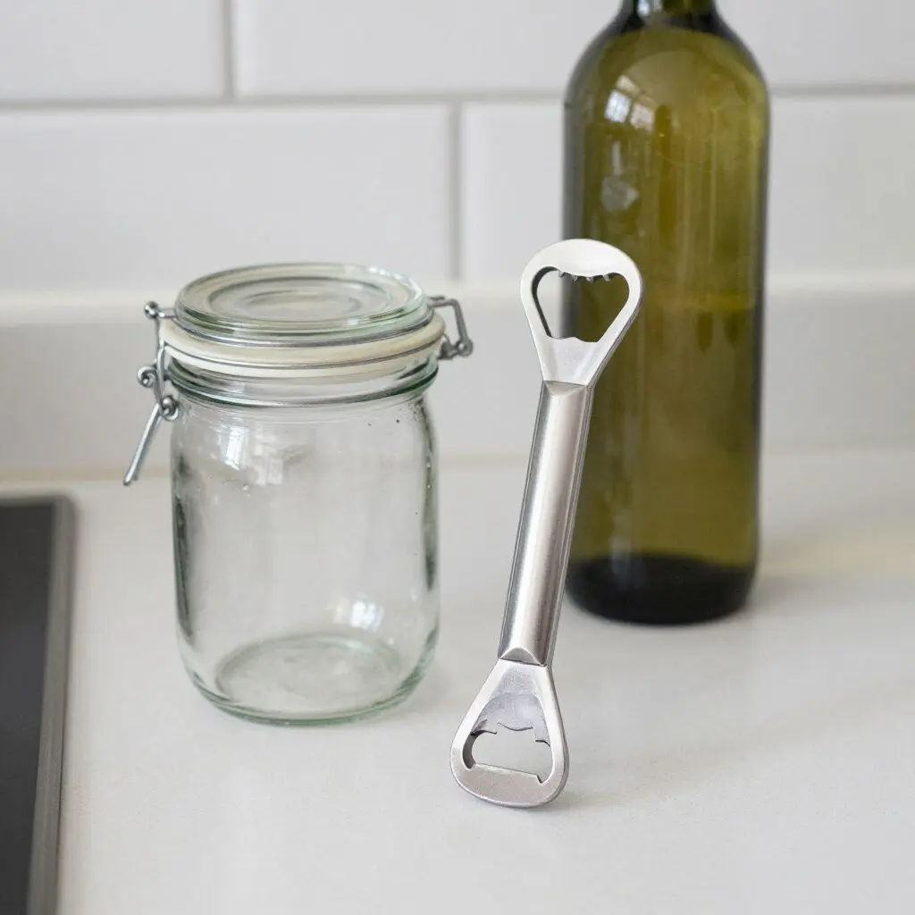 jar and bottle opener beside a sealed glass jar