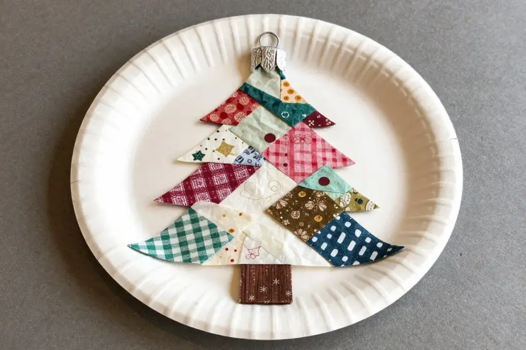 Giant paper plate Christmas bauble decorated with colorful tissue paper