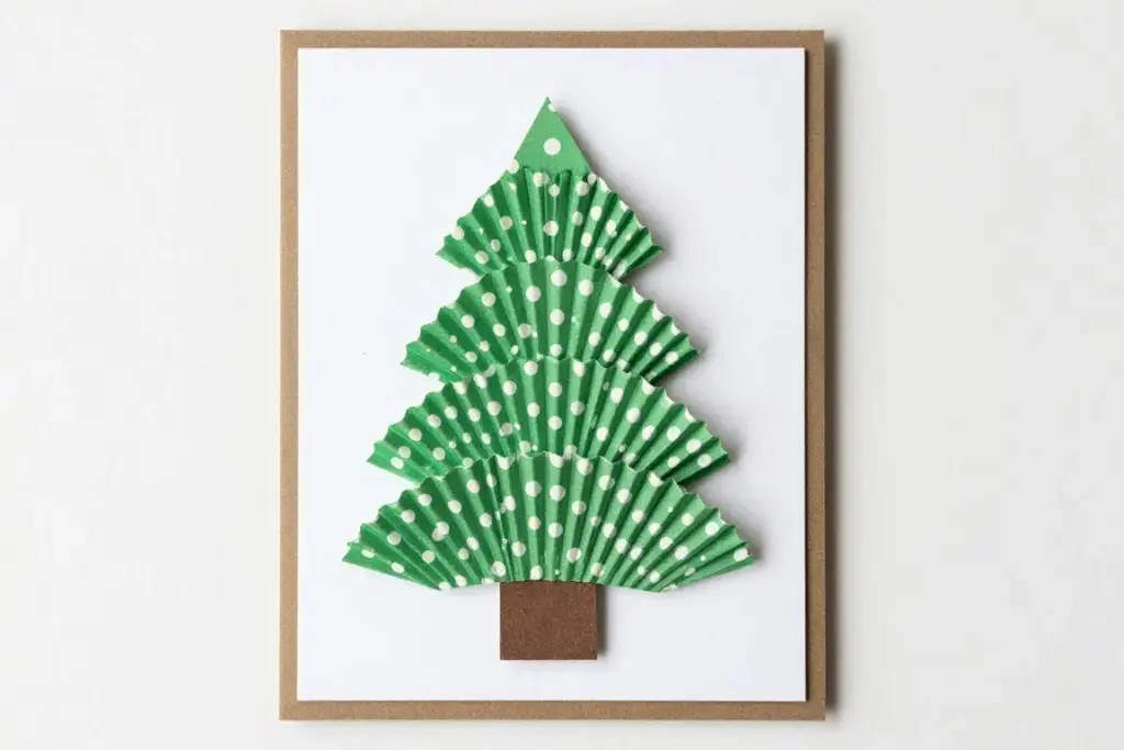 Layered cupcake liner Christmas tree craft glued on paper
