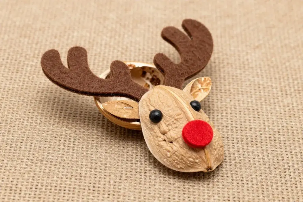 Walnut shell craft transformed into a cute reindeer with felt antlers